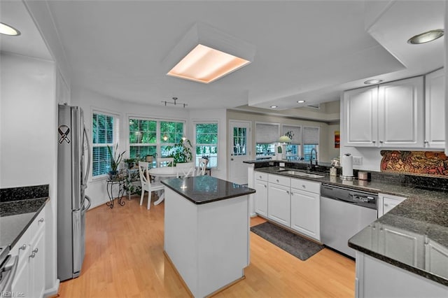 2537 Springhaven Dr, Virginia Beach, VA 23456 - kitchen with appliances with stainless steel finishes, a sink, white cabinets, light wood finished floors, and recessed lighting