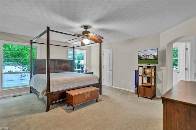 2537 Springhaven Dr, Virginia Beach, VA 23456 - bedroom with carpet floors, arched walkways, baseboards, a ceiling fan, and a textured ceiling