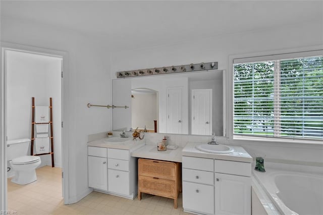 2537 Springhaven Dr, Virginia Beach, VA 23456 - bathroom featuring vanity, a garden tub, toilet, and tile patterned floors