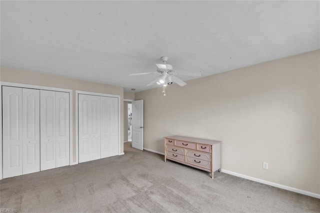 2537 Springhaven Dr, Virginia Beach, VA 23456 - unfurnished bedroom featuring multiple closets, baseboards, carpet, and ceiling fan