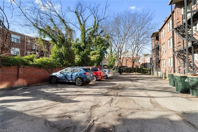 913 Spotswood Ave Unit 1, Norfolk, VA 23517 - uncovered parking lot featuring stairway and a residential view