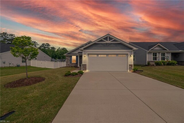 6729 Nolan Run, Gloucester, VA 23061 - craftsman inspired home featuring stone siding, concrete driveway, an attached garage, and board and batten siding