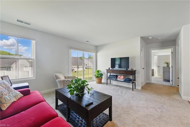 6729 Nolan Run, Gloucester, VA 23061 - living room featuring light colored carpet and baseboards