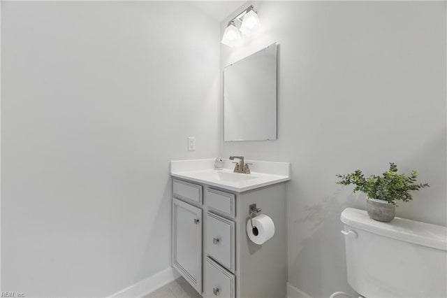 6729 Nolan Run, Gloucester, VA 23061 - bathroom with toilet, vanity, baseboards, and tile patterned floors