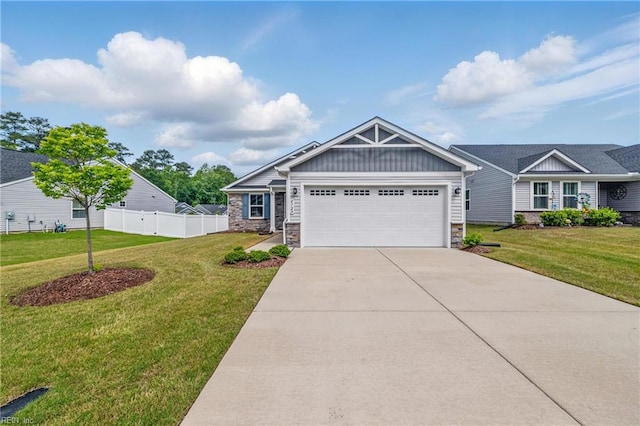 6729 Nolan Run, Gloucester, VA 23061 - craftsman inspired home with board and batten siding, stone siding, an attached garage, and concrete driveway