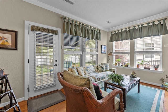 2968 Elegance Ln, Virginia Beach, VA 23456 - living area featuring crown molding, wood finished floors, and baseboards