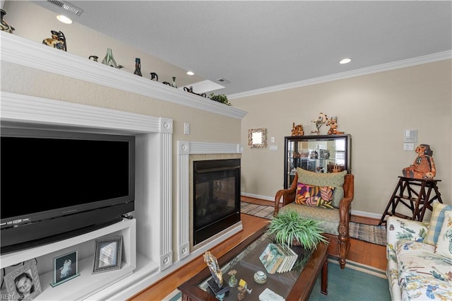 2968 Elegance Ln, Virginia Beach, VA 23456 - living room featuring a tiled fireplace, crown molding, wood finished floors, recessed lighting, and baseboards