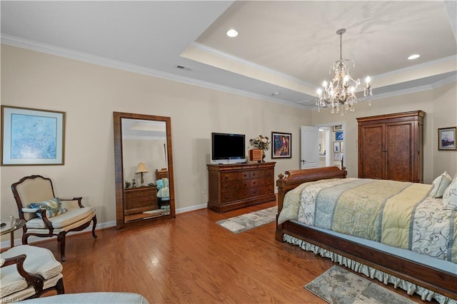 2968 Elegance Ln, Virginia Beach, VA 23456 - bedroom featuring a chandelier, crown molding, wood finished floors, a tray ceiling, and baseboards