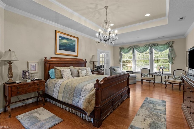 2968 Elegance Ln, Virginia Beach, VA 23456 - bedroom with a raised ceiling, a chandelier, wood finished floors, and crown molding