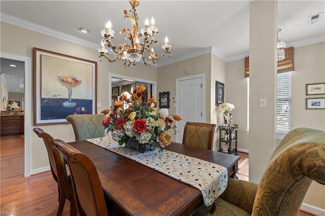 2968 Elegance Ln, Virginia Beach, VA 23456 - dining room with wood finished floors, a chandelier, ornamental molding, and baseboards