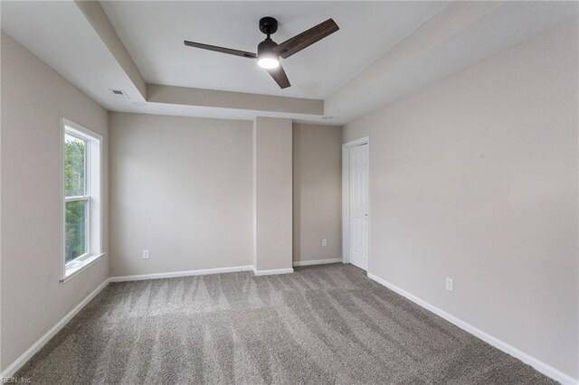 503 Middlesex St, Norfolk, VA 23523 - carpeted empty room with ceiling fan, a tray ceiling, and baseboards