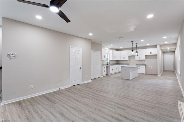 503 Middlesex St, Norfolk, VA 23523 - kitchen with baseboards, white cabinetry, a center island, light wood-style floors, and recessed lighting