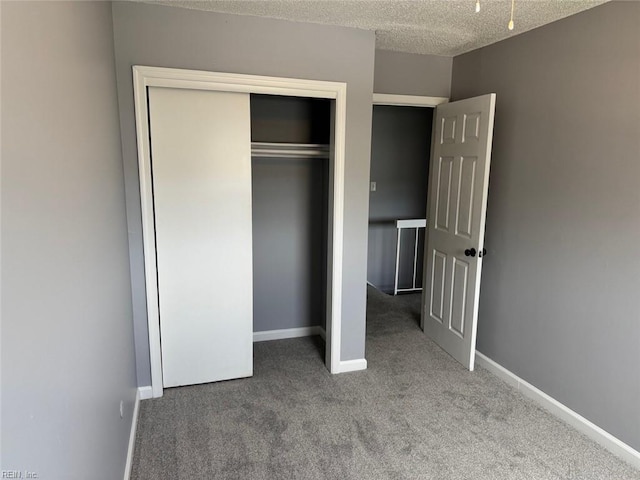 719 Tilden Pl, Virginia Beach, VA 23454 - unfurnished bedroom with carpet flooring, a closet, baseboards, and a textured ceiling
