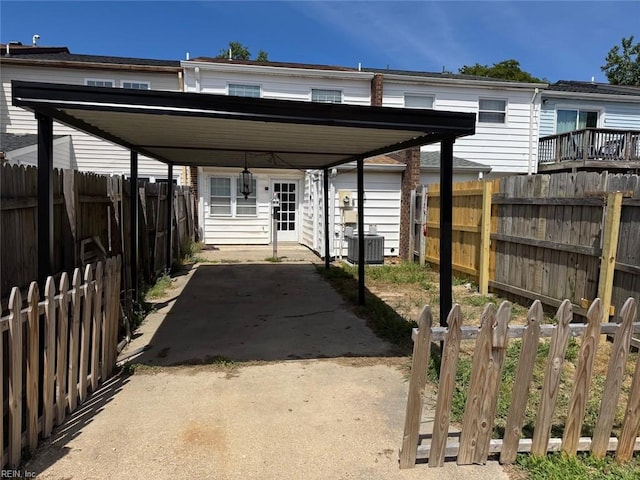 719 Tilden Pl, Virginia Beach, VA 23454 - view of patio with a carport, central AC, and a fenced backyard