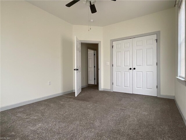 103 Lawrence Dr, Elizabeth City, NC 27909 - unfurnished bedroom with carpet flooring, baseboards, a ceiling fan, and a closet