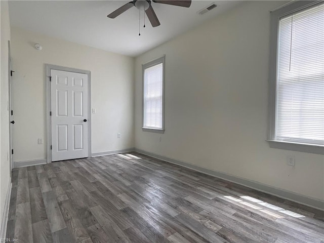 103 Lawrence Dr, Elizabeth City, NC 27909 - spare room featuring a ceiling fan, wood finished floors, baseboards, and a smoke detector