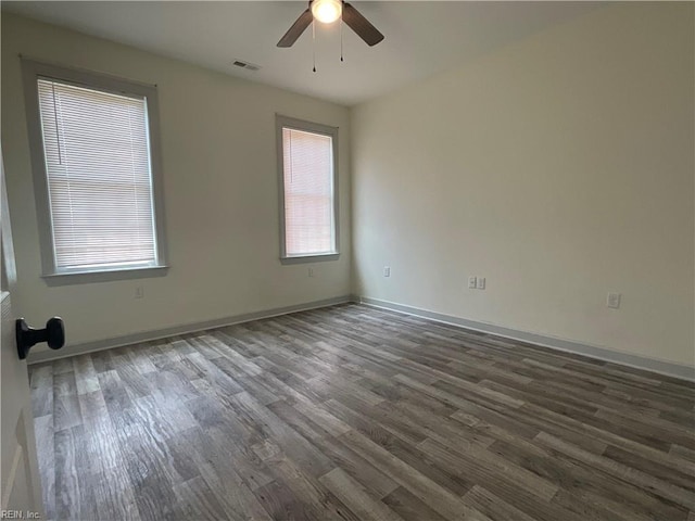 103 Lawrence Dr, Elizabeth City, NC 27909 - spare room with dark wood-type flooring, ceiling fan, and baseboards