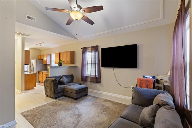 117 Bute St, Suffolk, VA 23434 - living room featuring lofted ceiling, ceiling fan, and baseboards