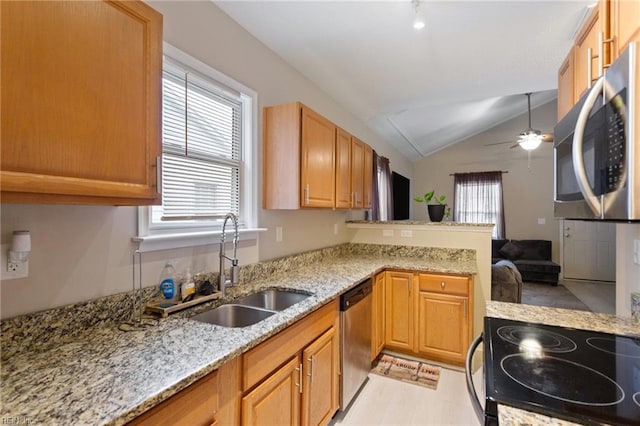 117 Bute St, Suffolk, VA 23434 - kitchen featuring appliances with stainless steel finishes, a sink, vaulted ceiling, ceiling fan, and a peninsula