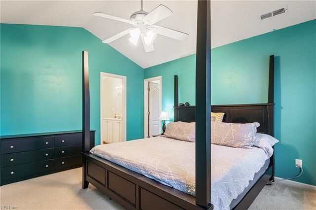 5049 Kelso St, Suffolk, VA 23435 - bedroom with vaulted ceiling, light carpet, ceiling fan, and ensuite bath