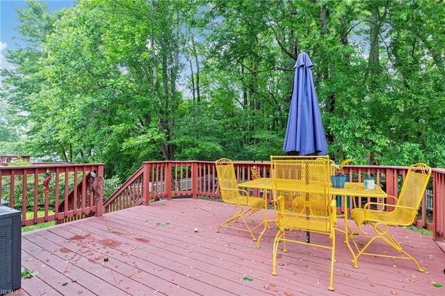 5049 Kelso St, Suffolk, VA 23435 - deck with central AC, view of wooded area, and outdoor dining space