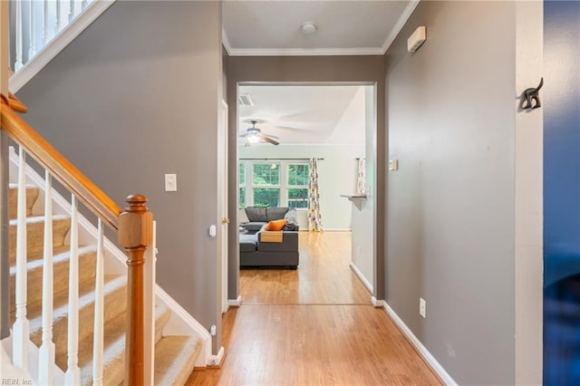 5049 Kelso St, Suffolk, VA 23435 - hallway featuring wood finished floors, stairway, ornamental molding, and baseboards