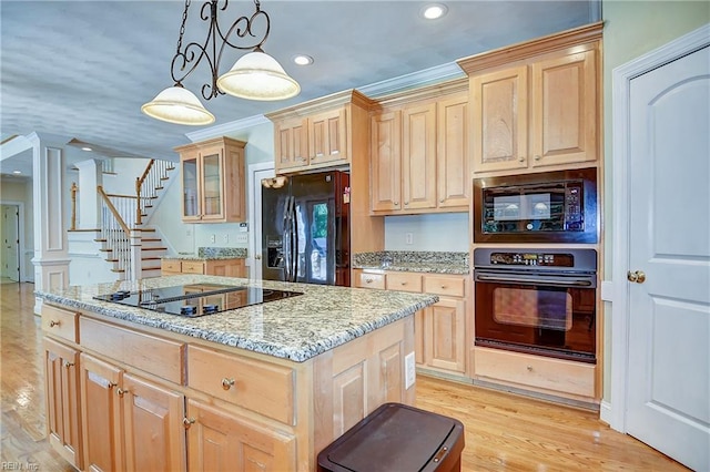 840 Forest Glade Dr, Chesapeake, VA 23322 - kitchen with black appliances, light brown cabinetry, a center island, recessed lighting, and light stone countertops