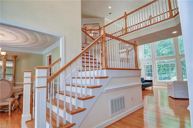 840 Forest Glade Dr, Chesapeake, VA 23322 - stairway with a towering ceiling, ornamental molding, wood finished floors, and a chandelier
