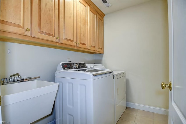 840 Forest Glade Dr, Chesapeake, VA 23322 - clothes washing area with washer and dryer, cabinet space, light tile patterned floors, and baseboards