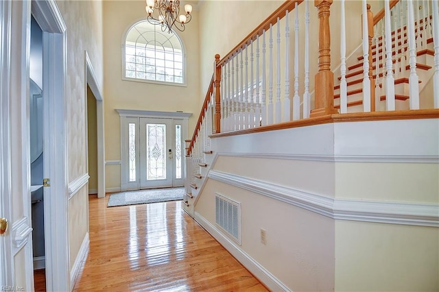 840 Forest Glade Dr, Chesapeake, VA 23322 - entrance foyer featuring stairs, a high ceiling, healthy amount of natural light, a chandelier, and wood finished floors