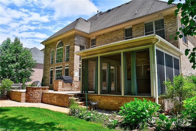 840 Forest Glade Dr, Chesapeake, VA 23322 - back of property with area for grilling, a sunroom, and brick siding