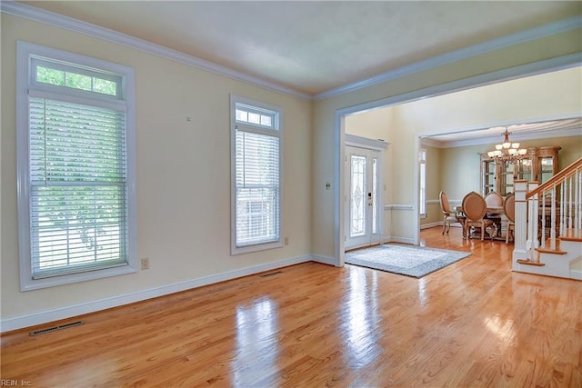 840 Forest Glade Dr, Chesapeake, VA 23322 - entryway with a chandelier, healthy amount of natural light, light wood finished floors, stairs, and ornamental molding