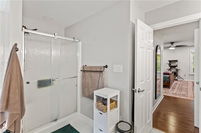 527 Lakeshead Dr, Williamsburg, VA 23185 - bathroom featuring a shower stall, wood finished floors, a ceiling fan, and baseboards