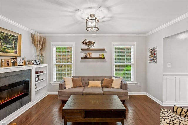 527 Lakeshead Dr, Williamsburg, VA 23185 - living area featuring dark wood-type flooring, plenty of natural light, ornamental molding, a glass covered fireplace, and baseboards
