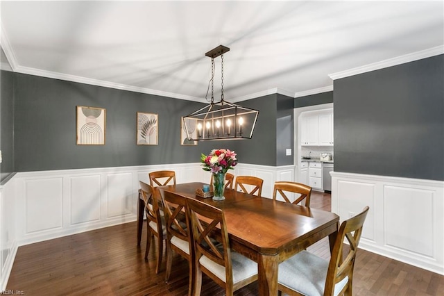 527 Lakeshead Dr, Williamsburg, VA 23185 - dining area with dark wood-type flooring, a decorative wall, wainscoting, ornamental molding, and a chandelier