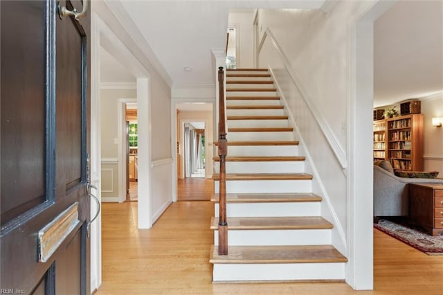 122 Archer Rd, Newport News, VA 23606 - foyer with light wood-type flooring, stairway, crown molding, a wainscoted wall, and a decorative wall