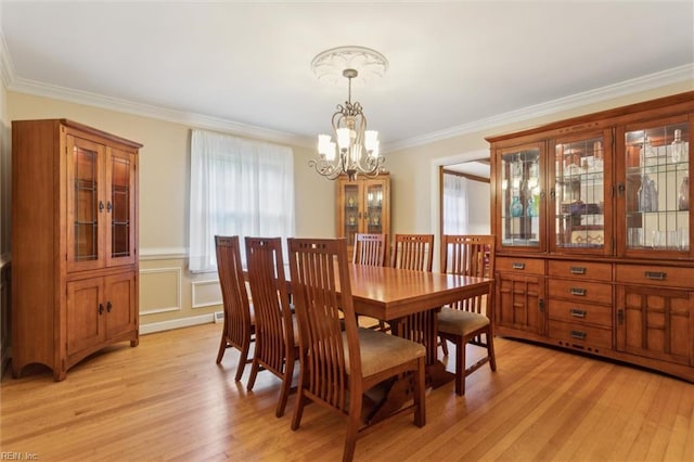 122 Archer Rd, Newport News, VA 23606 - dining area featuring a chandelier, crown molding, light wood-type flooring, and a wainscoted wall