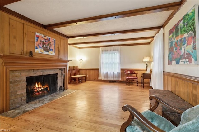 122 Archer Rd, Newport News, VA 23606 - living room featuring a fireplace, wainscoting, beamed ceiling, wood-type flooring, and wooden walls