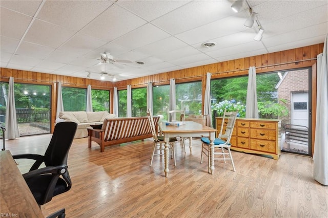 122 Archer Rd, Newport News, VA 23606 - sunroom with rail lighting, wood finished floors, wooden walls, and a wooden deck