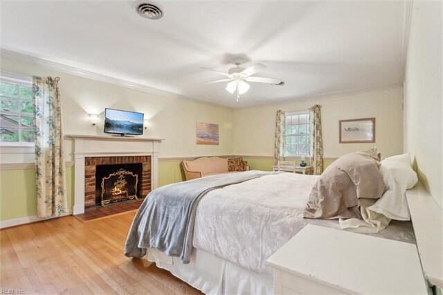122 Archer Rd, Newport News, VA 23606 - bedroom with ornamental molding, light wood-style flooring, a fireplace, baseboards, and a ceiling fan