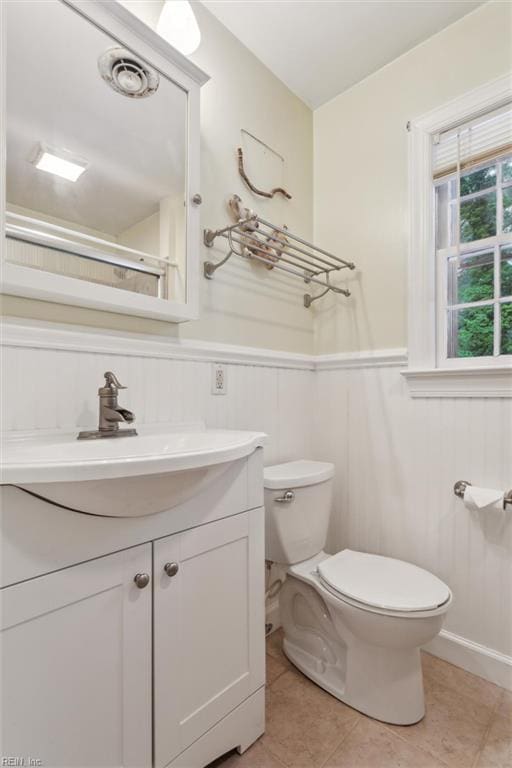122 Archer Rd, Newport News, VA 23606 - bathroom with toilet, wainscoting, vanity, and tile patterned floors