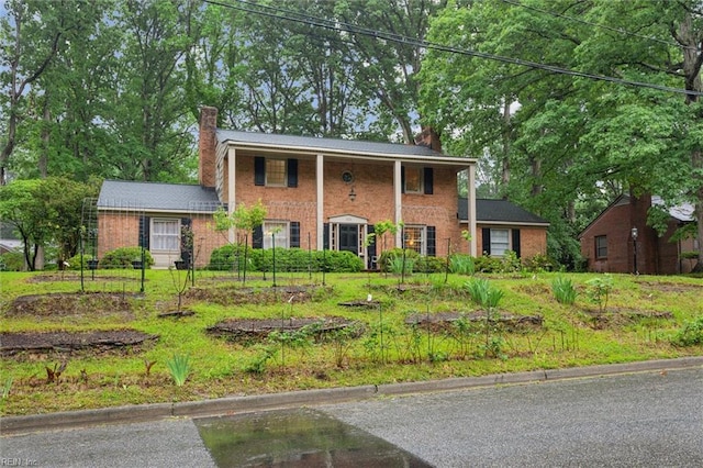 122 Archer Rd, Newport News, VA 23606 - greek revival house with a chimney and brick siding