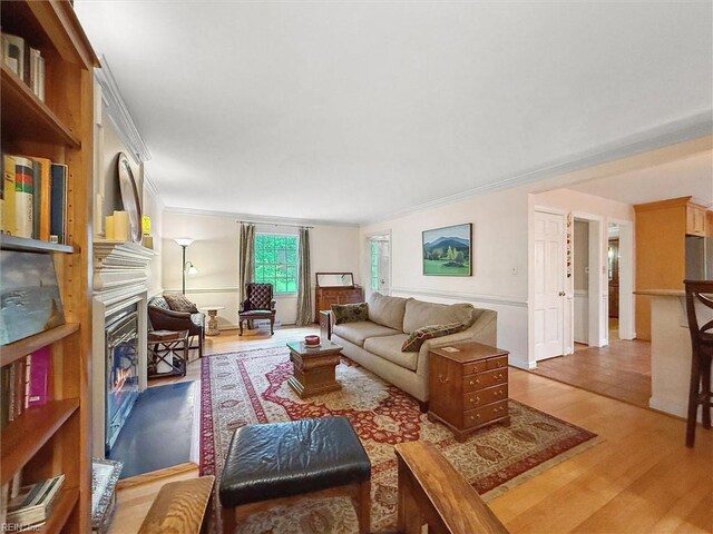122 Archer Rd, Newport News, VA 23606 - living area featuring ornamental molding, light wood-type flooring, and a glass covered fireplace