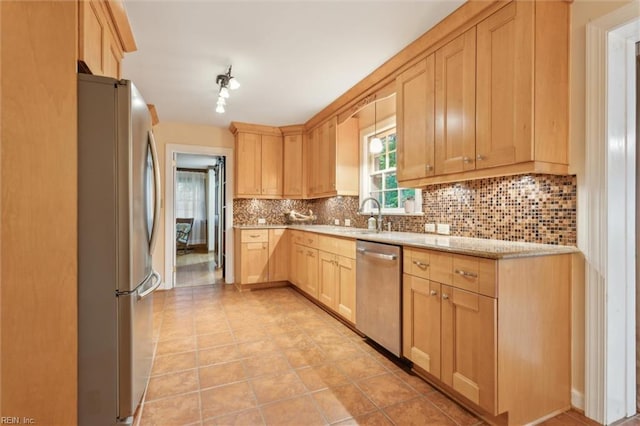 122 Archer Rd, Newport News, VA 23606 - kitchen with stainless steel appliances, light brown cabinetry, backsplash, and a sink