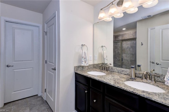 20 Pickins Dr, Poquoson, VA 23662 - bathroom featuring double vanity and a tile shower