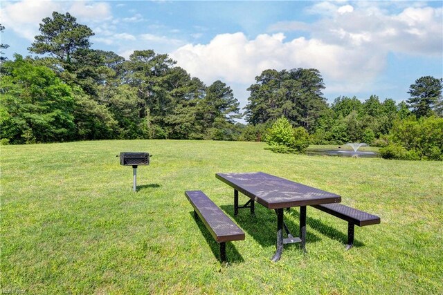 20 Pickins Dr, Poquoson, VA 23662 - surrounding community with a lawn and a view of trees