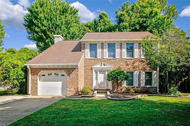 810 Erskine St, Hampton, VA 23666 - colonial home featuring brick siding, an attached garage, a chimney, driveway, and a front lawn