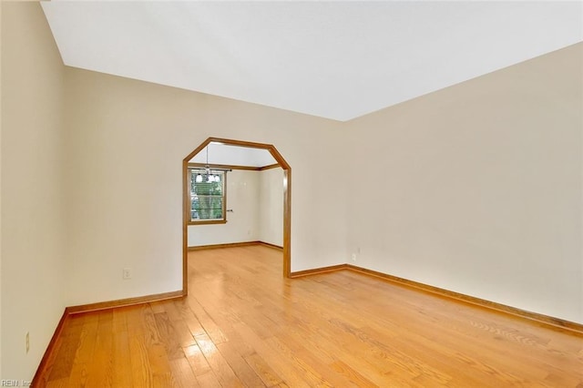 810 Erskine St, Hampton, VA 23666 - unfurnished room featuring light wood finished floors, baseboards, and arched walkways