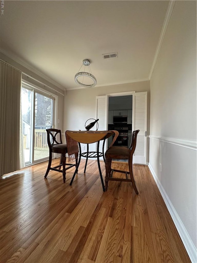 2800 Candlewood Cir, Chesapeake, VA 23324 - dining area with crown molding, wood finished floors, baseboards, and an office area
