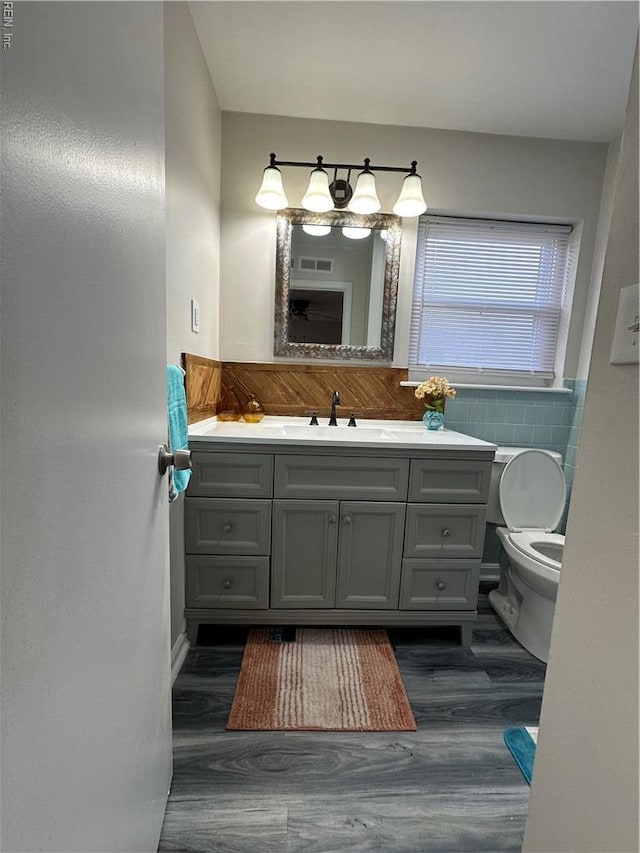 2800 Candlewood Cir, Chesapeake, VA 23324 - bathroom featuring wood finished floors, vanity, and toilet
